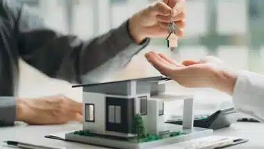 Real estate professionals and clients discussing home purchases