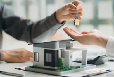 Real estate professionals and clients discussing home purchases
