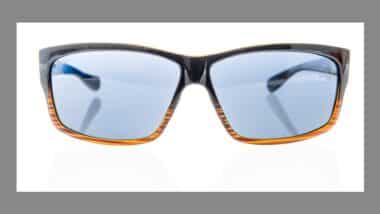 A pair of Costa polarized sunglasses on an isolated background