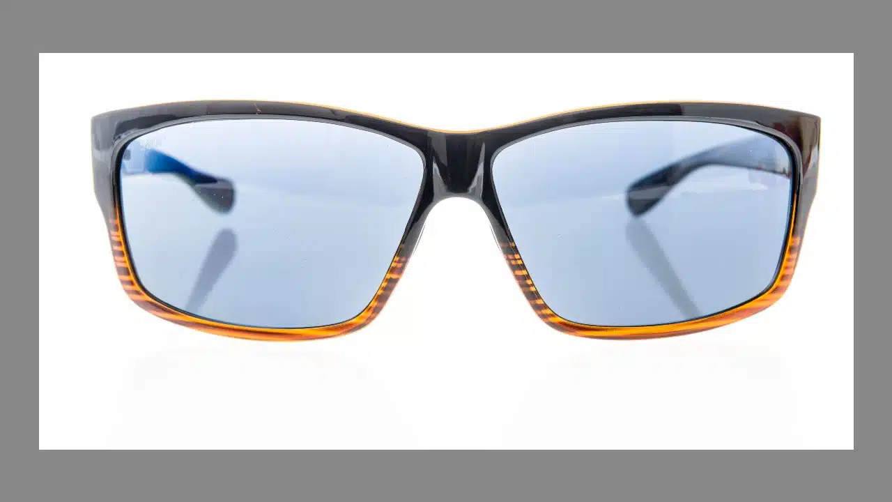 A pair of Costa polarized sunglasses on an isolated background