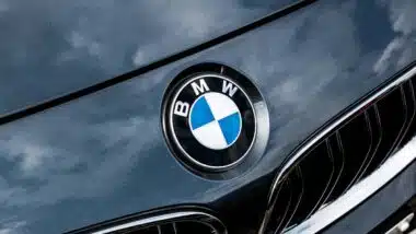 Close up of BMW emblem on a front bumper, representing the BMW recall.