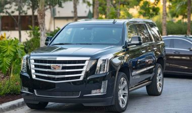 A black Cadillac Escalade parked on a street, representing the GM class action.