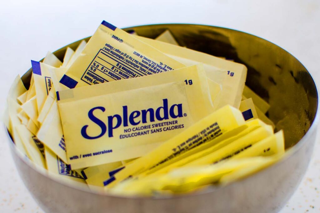 Close up of Splenda packets in a bowl, representing Splenda class action lawsuit.