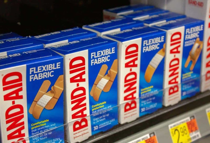 Close up of Johnson & Johnson Band-Aid products on a supermarket shelf, representing the Band-Aid class action.
