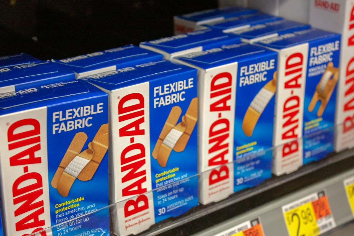 Close up of Johnson & Johnson Band-Aid products on a supermarket shelf, representing the Band-Aid class action.