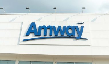 Close up of Amway signage, representing the Amway settlement.