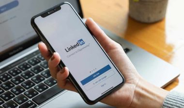 LinkedIn sign in page displayed on smartphone screen, representing LinkedIn fake click settlement.