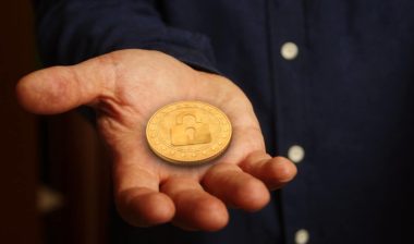 Cryptocurrency coin with a lock image on it