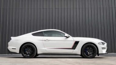 Side view of a white Ford Mustang, representing the Ford Mustang recall.