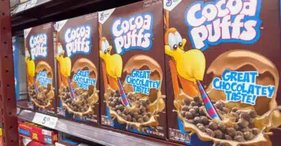 Cocoa Puffs products on a supermarket shelf,