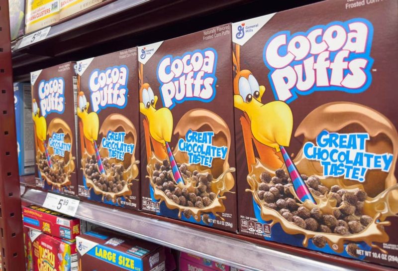 Cocoa Puffs products on a supermarket shelf,