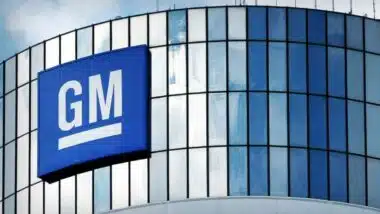 General Motors signage on a building in New York, representing GM class actions and settlements.