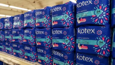 Kotex tampon products on a supermarket shelf, representing the Tampax and Kotex class actions.