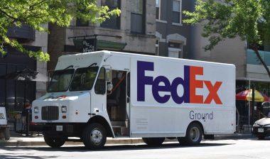 Fedex Delivery Truck parked on side of the road, representing the FedEx class action.