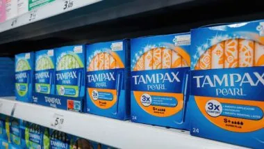 Tampax products on a supermarket shelf, representing the Tampax lead class action.