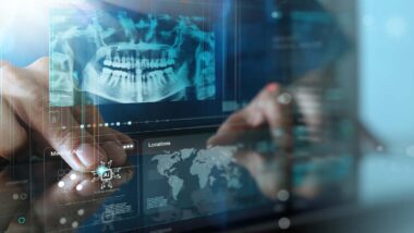 Dentist using a tablet with a dental x-ray overlay, representing the Great Expressions settlement.