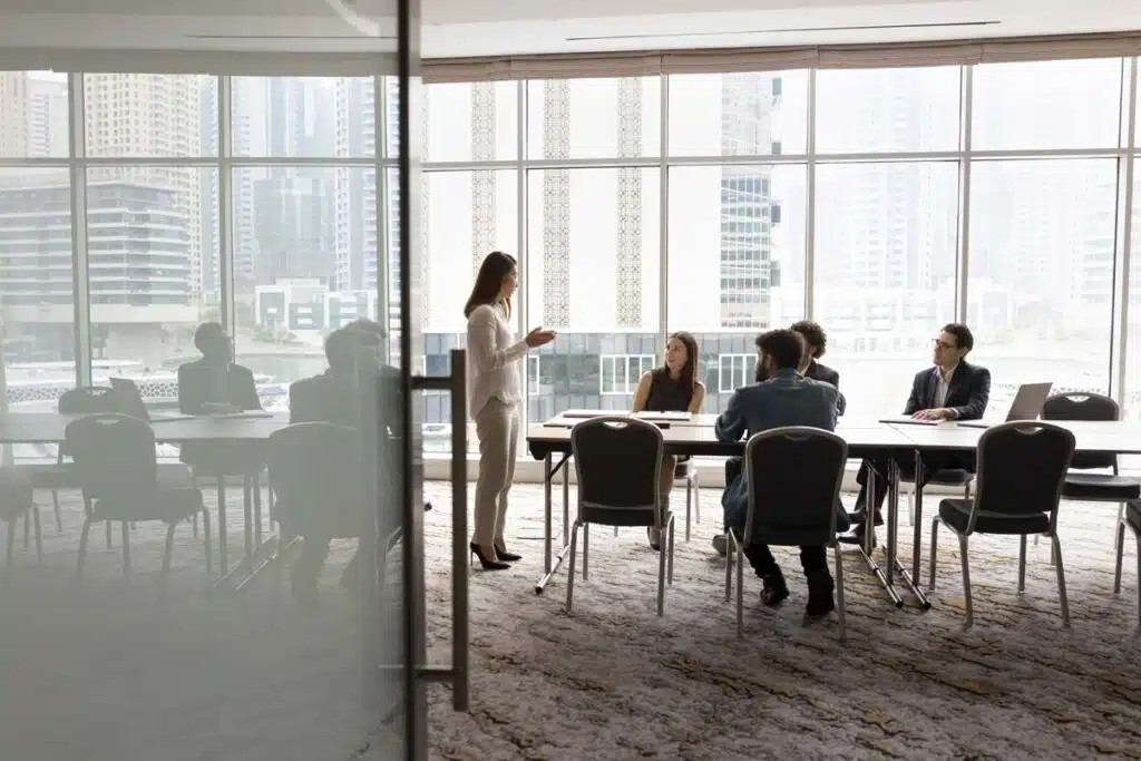 A group of employees working together, representing the employment class actions.