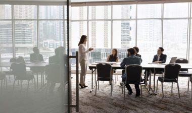 A group of employees working together, representing the employment class actions.