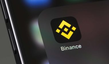 Close up of Binance mobile app displayed on a smartphone screen, representing the Binance class action.