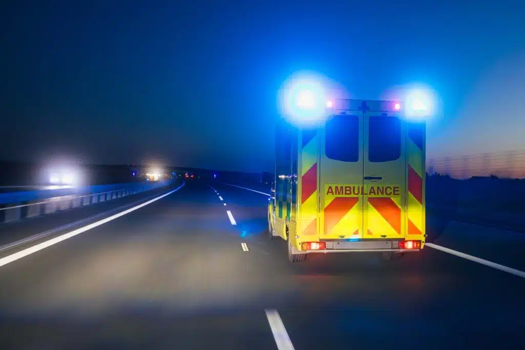 An ambulance driving down a roadway, representing the Acadian Ambulance data breach.