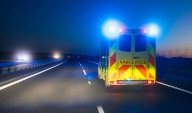 An ambulance driving down a roadway, representing the Acadian Ambulance data breach.