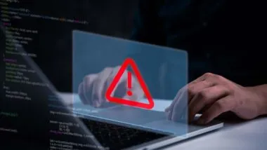 Close up of a man typing on a laptop with a data breach concept overlay, representing the National Public Data class action.