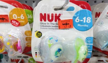 Close up of Nuk pacifier products on display in a store, representing the Nuk pacifier class action.