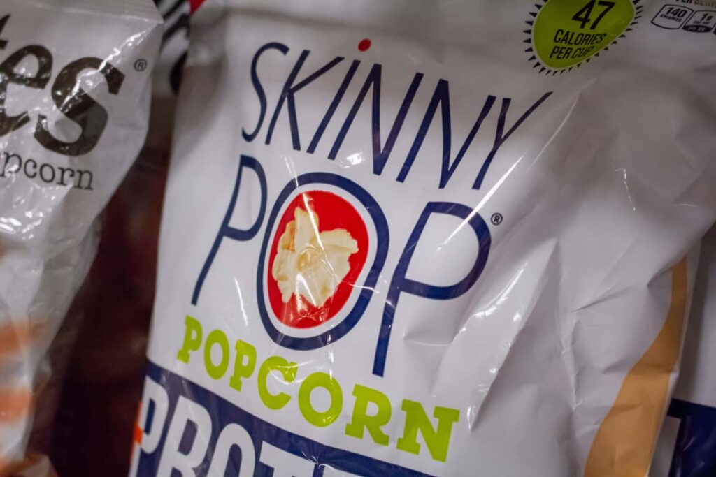 SkinnyPop popcorn bag on display in a supermarket, representing the SkinnyPop class action.