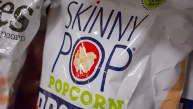 SkinnyPop popcorn bag on display in a supermarket, representing the SkinnyPop class action.