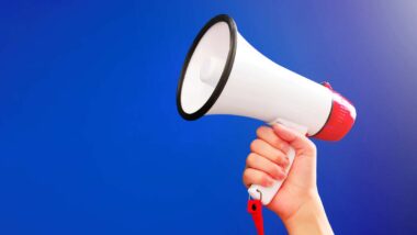 Close up of a hand holding a megaphone, representing top recalls for the week of Sept. 16.