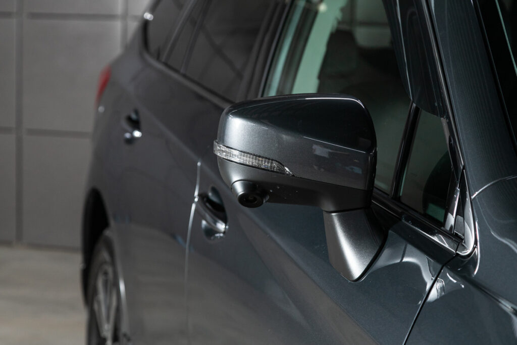 Close of Subaru side mirror representing the Subaru class action.