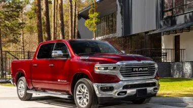 A Red Ram 1500 in a driveway, representing the Ram 1500 recall.