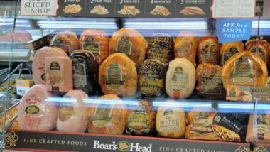 Boar's Head food products on display in a grocery store, representing the Boar's Head recall.