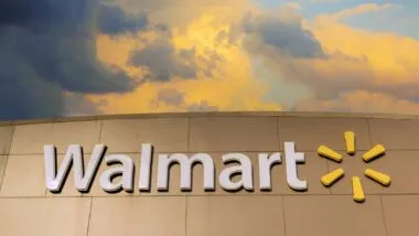 Close up of Walmart signage against a sunset sky, representing the Walmart class action.