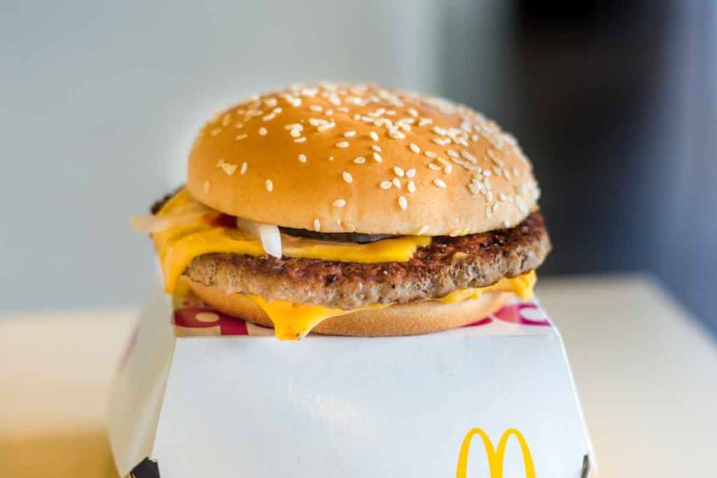 Close up of a McDonald's quarter pounder hamburger, representing the McDonald's E. coli outbreak.