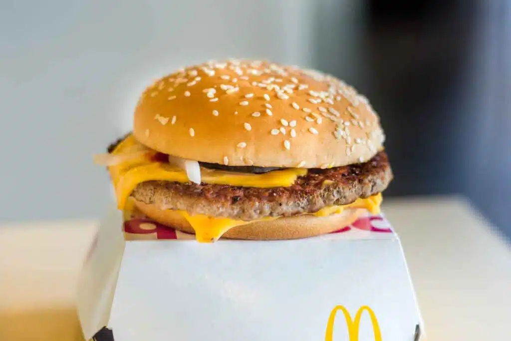 Close up of a McDonald's quarter pounder hamburger, representing the McDonald's E. coli outbreak.
