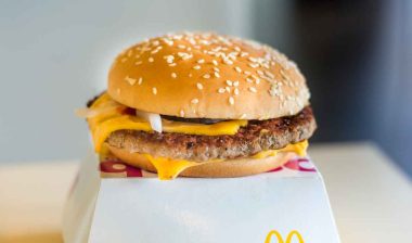Close up of a McDonald's quarter pounder hamburger, representing the McDonald's E. coli outbreak.