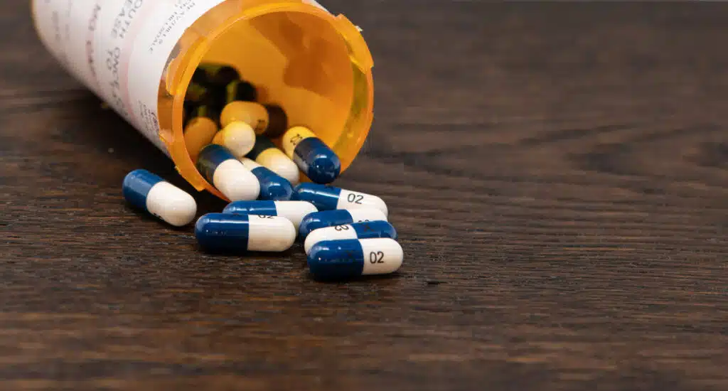 A pill bottle spilled across the floor representing the Cymbalta recall.