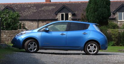 Side view of a blue Nissan Leaf, representing the Nissan recall.