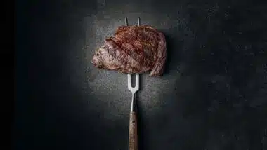 Cooked meat on a cooking utensil, representing the meat recall.