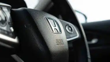 Close up of a Honda steering wheel, representing the Honda recall.