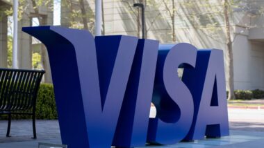 Visa credit card logo in big letters outside headquarters representing the Visa lawsuit.