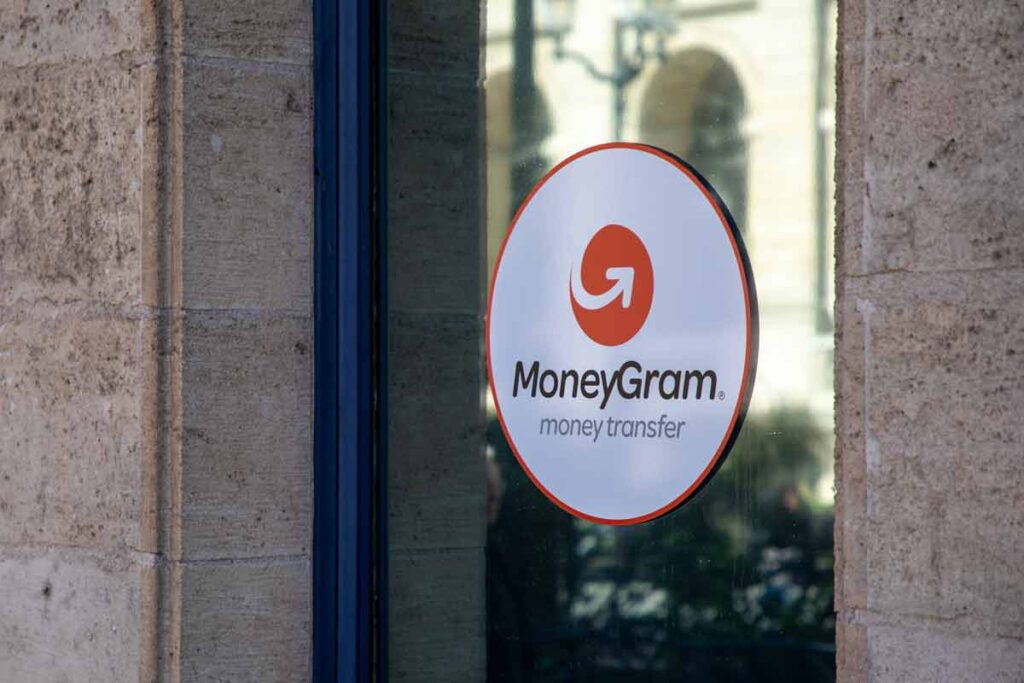 MoneyGram advertising sticker in a window, representing the MoneyGram class action.