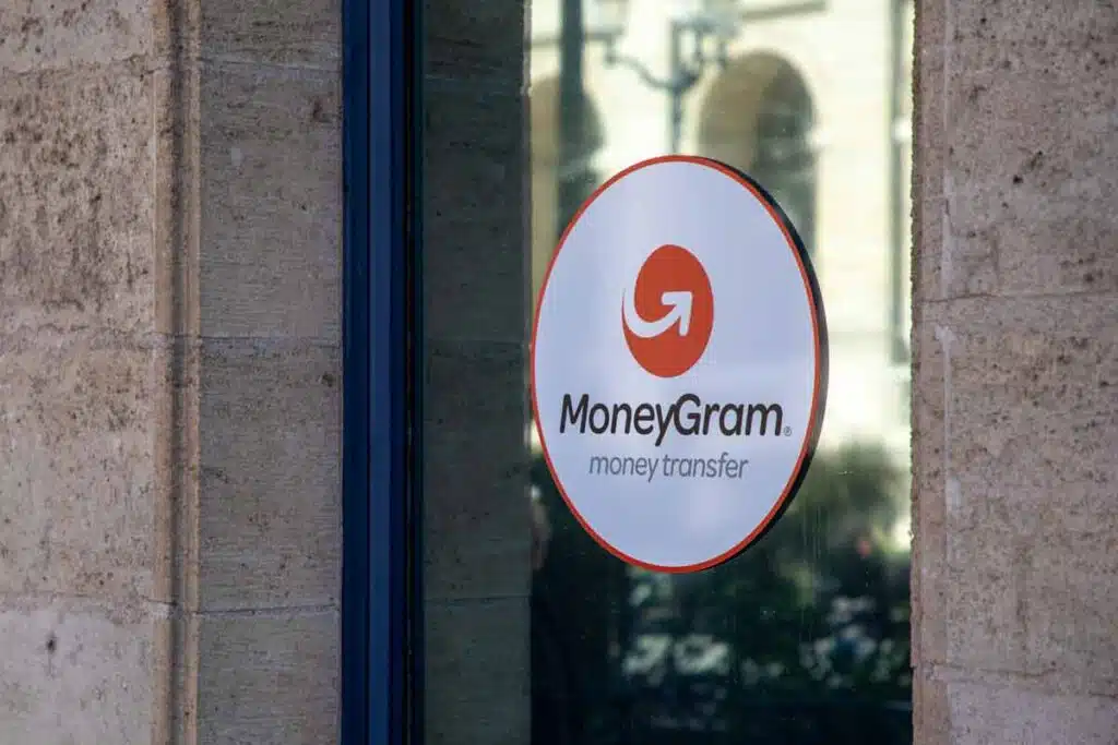 MoneyGram advertising sticker in a window, representing the MoneyGram class action.