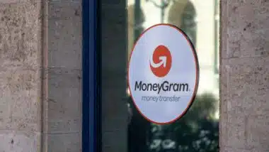 MoneyGram advertising sticker in a window, representing the MoneyGram class action.