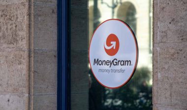 MoneyGram advertising sticker in a window, representing the MoneyGram class action.