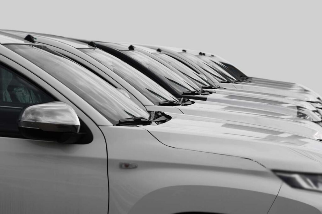 Close up of white cars, representing September auto recalls.
