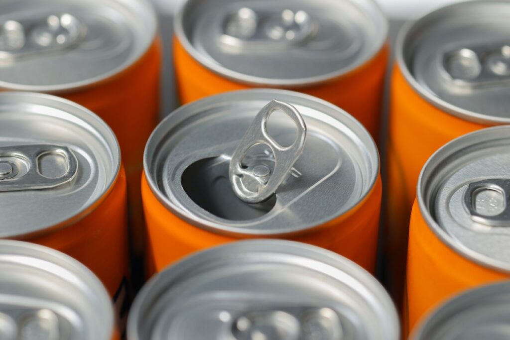 Cans of orange soda representing the orange soda class action.