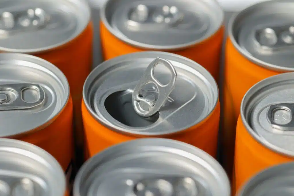 Cans of orange soda representing the orange soda class action.