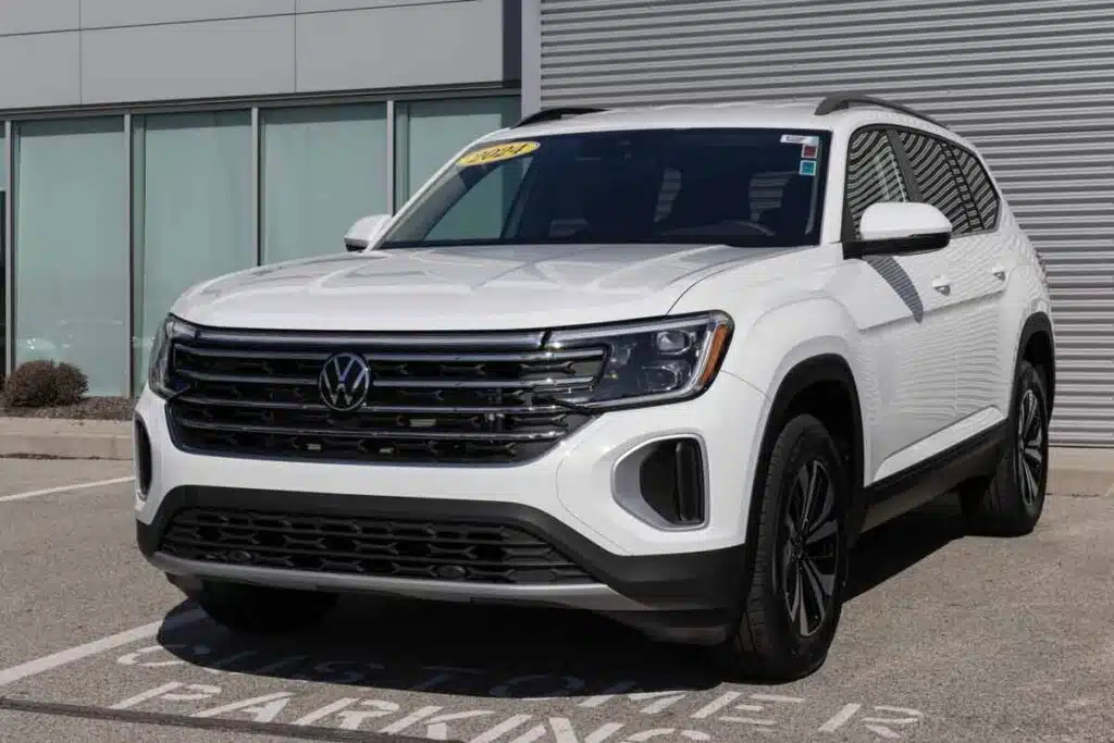 A 2024 white Volkswagen Atlas in a parking lot, representing the VW class action.